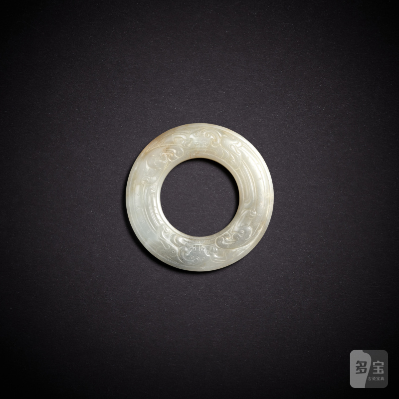 A white jade 'chilong' disc, huan, Southern Song dynasty | 南宋 白玉螭龍紋環